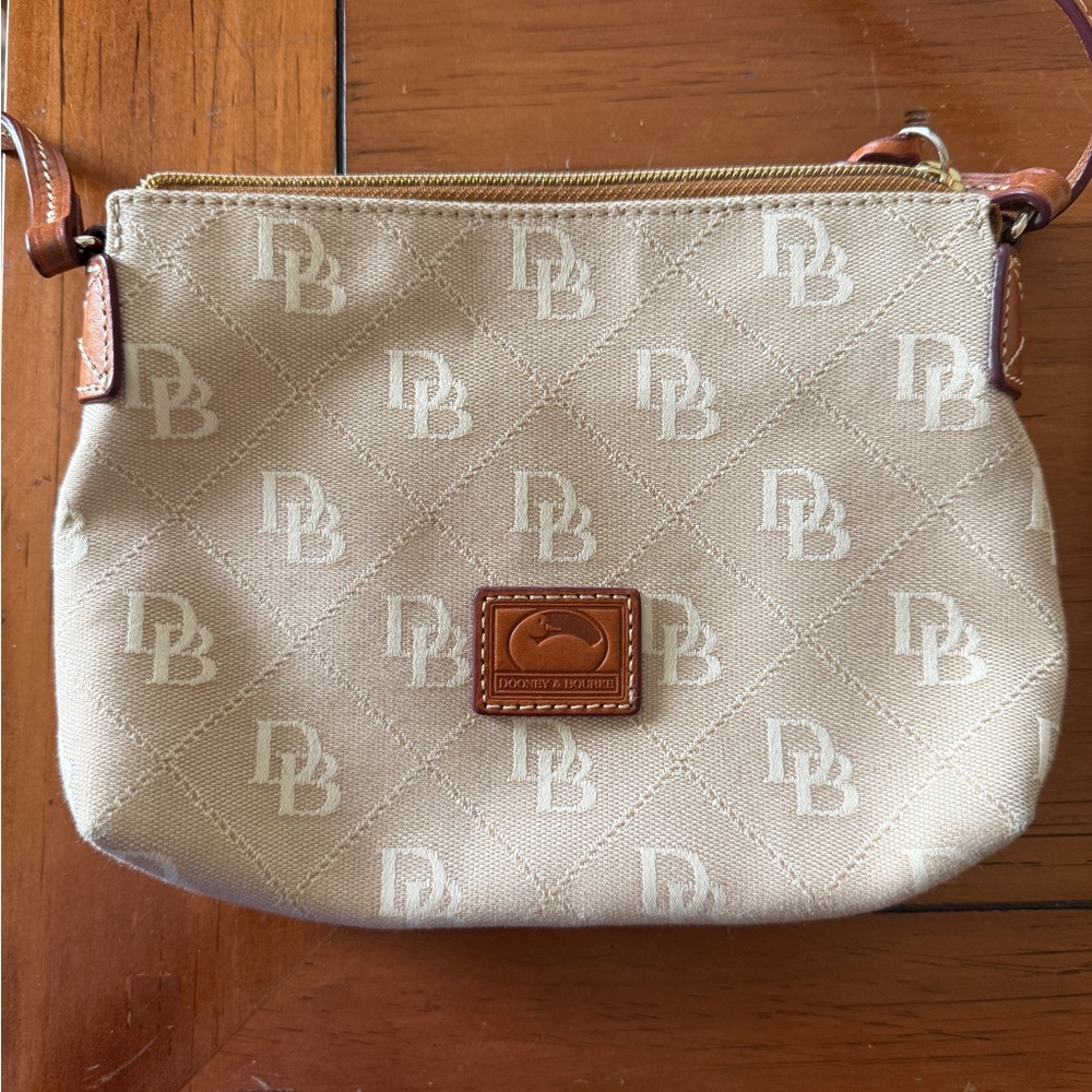 Dooney & Bourke Tan Crossbody Bag great for any occasion.